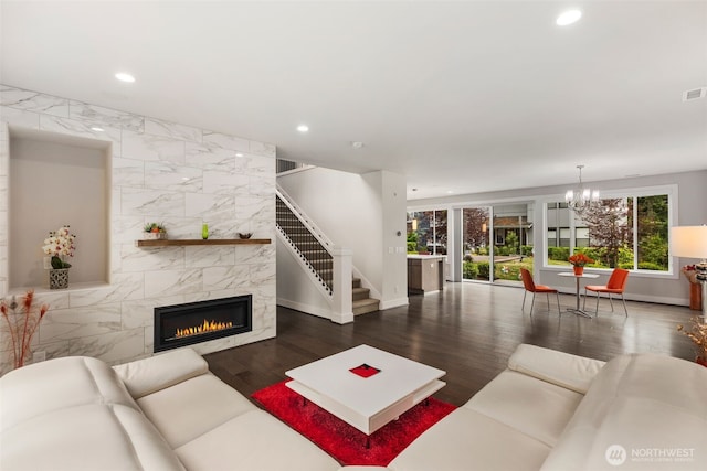 587 155th Pl NE, Bellevue, WA 98007 - living area with recessed lighting, a chandelier, wood finished floors, a premium fireplace, and stairs