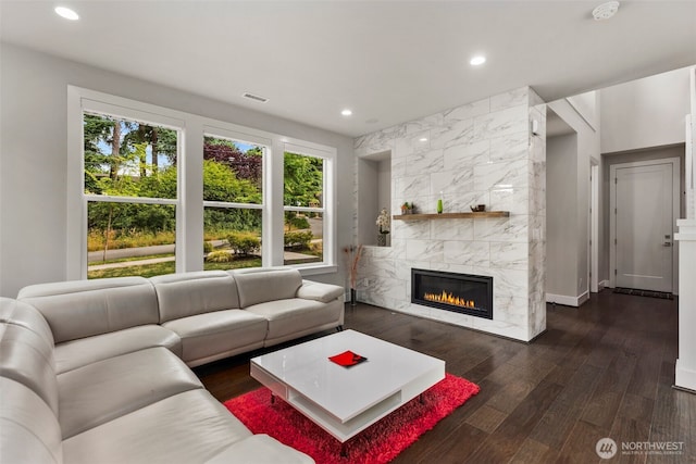 587 155th Pl NE, Bellevue, WA 98007 - living area with wood finished floors, recessed lighting, and a fireplace