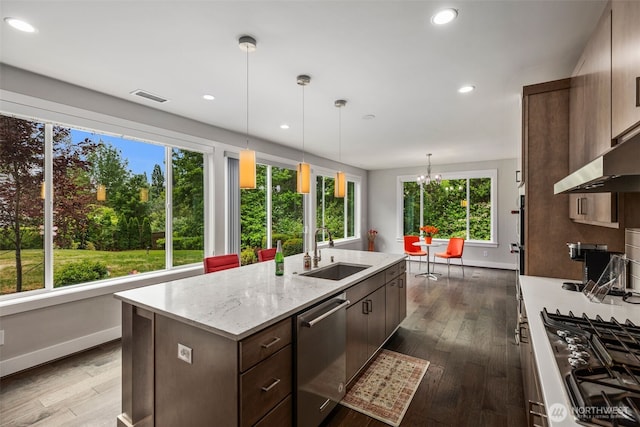 587 155th Pl NE, Bellevue, WA 98007 - kitchen featuring appliances with stainless steel finishes, healthy amount of natural light, dark wood-style floors, and recessed lighting