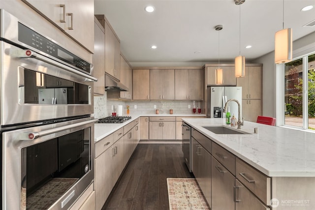 587 155th Pl NE, Bellevue, WA 98007 - kitchen featuring appliances with stainless steel finishes, dark wood-style floors, recessed lighting, backsplash, and a center island with sink