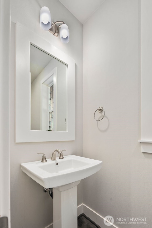 587 155th Pl NE, Bellevue, WA 98007 - bathroom featuring a sink and baseboards