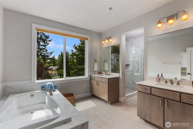 587 155th Pl NE, Bellevue, WA 98007 - full bathroom featuring plenty of natural light, two vanities, a shower stall, and a garden tub