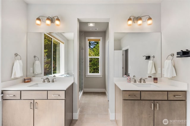 587 155th Pl NE, Bellevue, WA 98007 - full bathroom with healthy amount of natural light, two vanities, and tile patterned flooring
