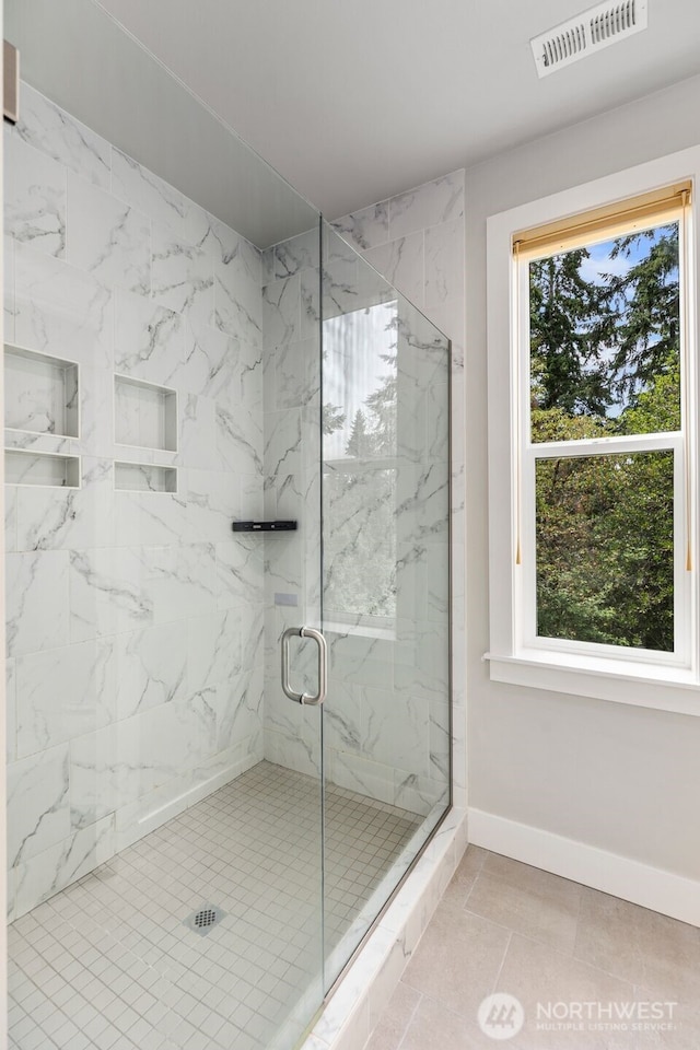587 155th Pl NE, Bellevue, WA 98007 - bathroom with baseboards and a marble finish shower