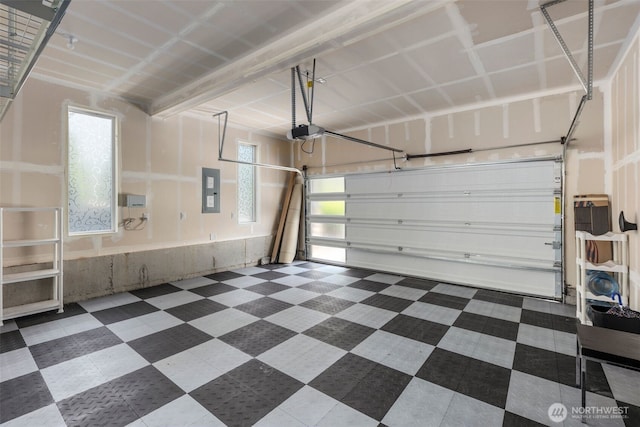 587 155th Pl NE, Bellevue, WA 98007 - garage featuring a garage door opener and electric panel