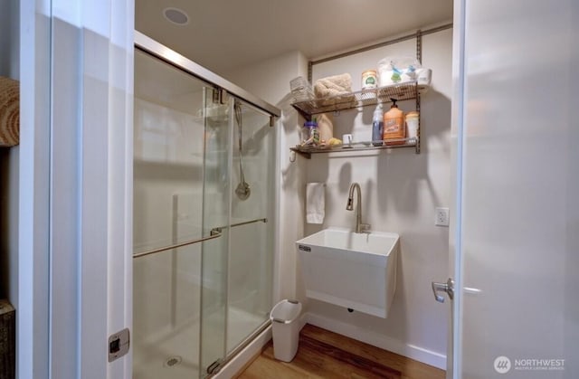 999 41st Ln, Seaview, WA 98644 - full bathroom featuring wood finished floors and a stall shower