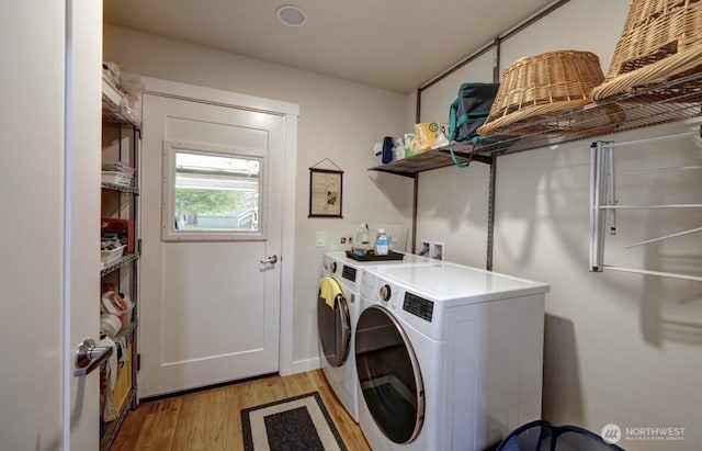 999 41st Ln, Seaview, WA 98644 - laundry area with independent washer and dryer and light wood-style floors