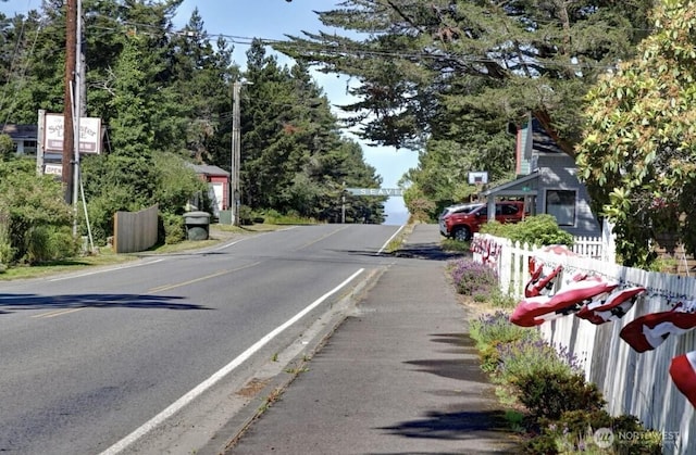 999 41st Ln, Seaview, WA 98644 - view of asphalt road featuring sidewalks