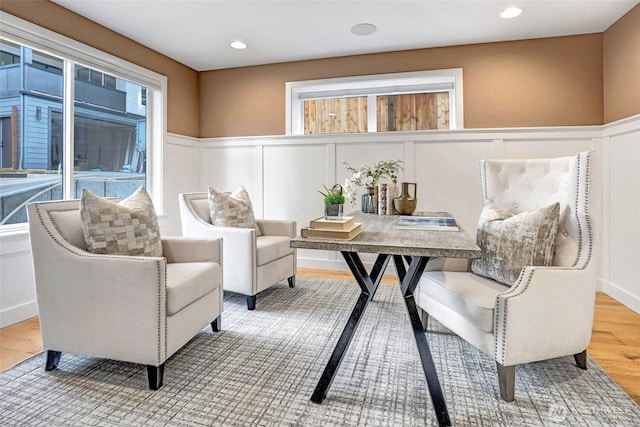 11216 NE 67th St Unit 4, Kirkland, WA 98033 - sitting room featuring a decorative wall, a wainscoted wall, wood finished floors, and recessed lighting