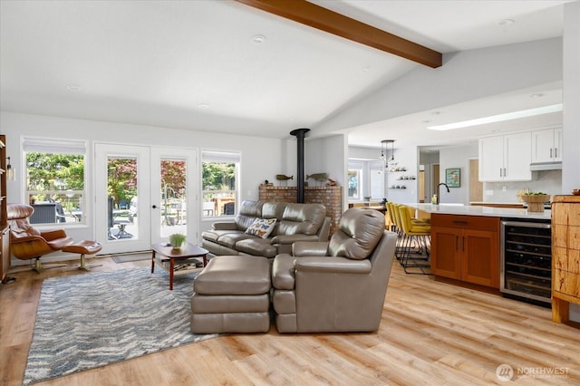 1043 NE Pennington Loop, Coupeville, WA 98239 - living area with wine cooler, light wood-style floors, and a wood stove