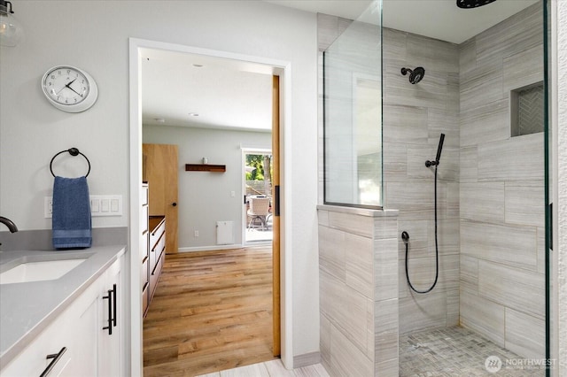 1043 NE Pennington Loop, Coupeville, WA 98239 - full bath featuring vanity, a walk in shower, and wood finished floors