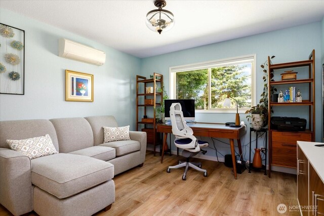 1043 NE Pennington Loop, Coupeville, WA 98239 - home office featuring a wall mounted AC and light wood finished floors