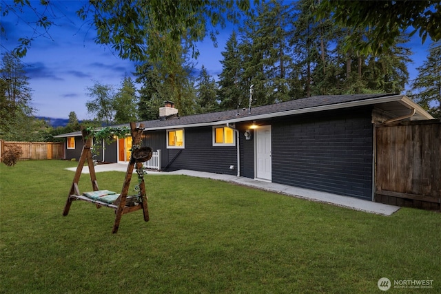 10403 Wauna St SW, Lakewood, WA 98498 - rear view of property featuring a chimney