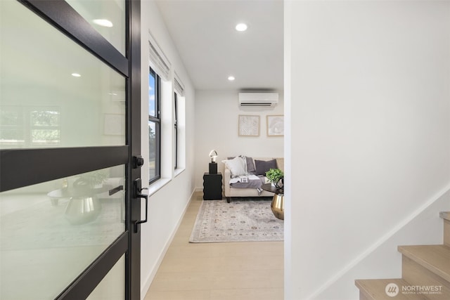 2912 SW Thistle St Unit B, Seattle, WA 98126 - hallway with an AC wall unit, recessed lighting, light wood finished floors, and stairway