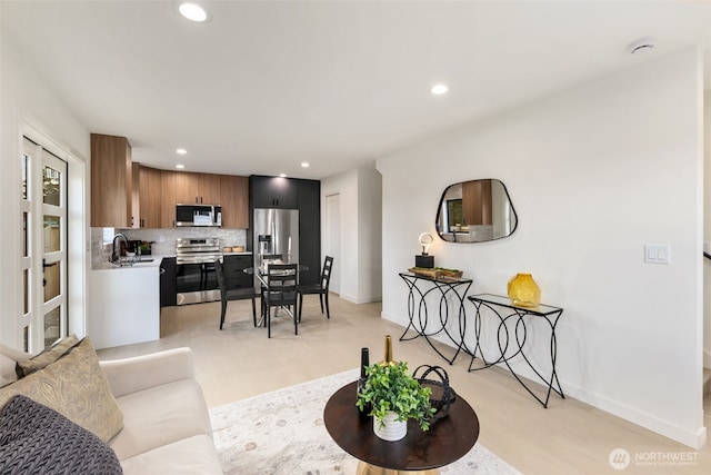 2912 SW Thistle St Unit B, Seattle, WA 98126 - living area featuring baseboards and recessed lighting
