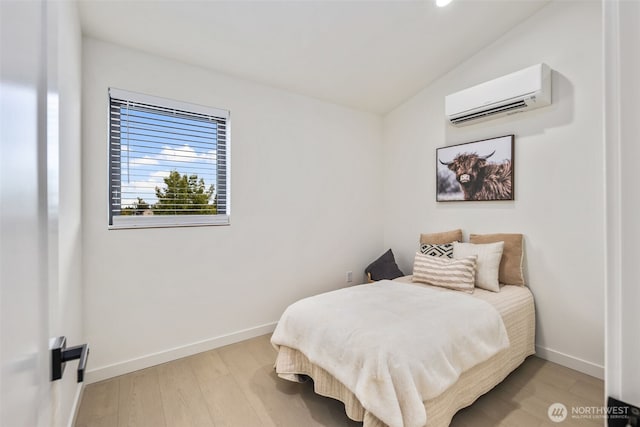 2912 SW Thistle St Unit B, Seattle, WA 98126 - bedroom with a wall mounted AC, light wood-style floors, recessed lighting, and lofted ceiling