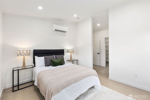 2912 SW Thistle St Unit B, Seattle, WA 98126 - bedroom featuring a wall mounted air conditioner, light wood-style floors, and recessed lighting