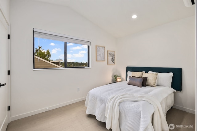 2912 SW Thistle St Unit B, Seattle, WA 98126 - bedroom with wood finished floors, lofted ceiling, and recessed lighting