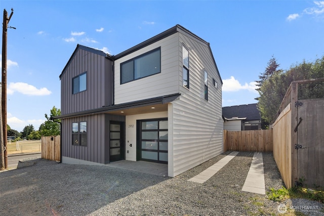 2912 SW Thistle St Unit B, Seattle, WA 98126 - contemporary house with board and batten siding and a fenced backyard