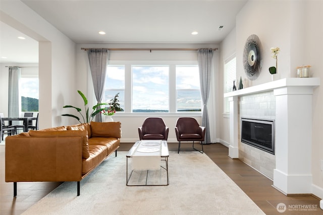 1297 Westridge Way NE, Issaquah, WA 98029 - living area featuring wood finished floors, recessed lighting, and a fireplace