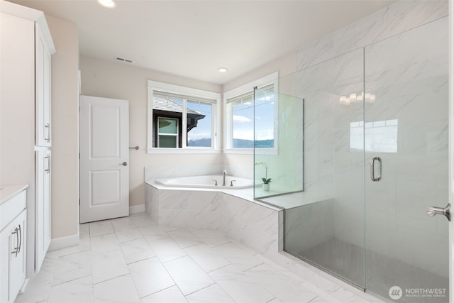 1297 Westridge Way NE, Issaquah, WA 98029 - full bath featuring a garden tub, vanity, a marble finish shower, recessed lighting, and marble look tile flooring