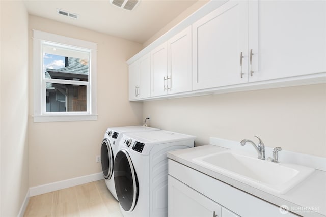 1297 Westridge Way NE, Issaquah, WA 98029 - washroom with separate washer and dryer and cabinet space