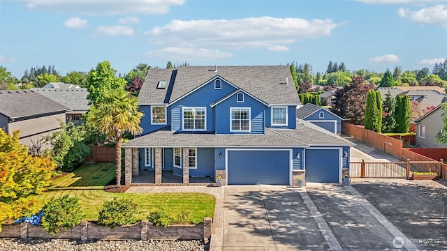 10400 NE 197th St, Battle Ground, WA 98604 - traditional home featuring driveway, a shingled roof, and an attached garage