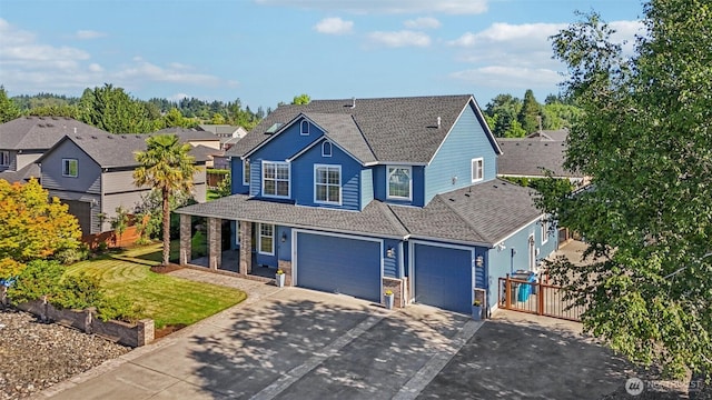 10400 NE 197th St, Battle Ground, WA 98604 - traditional home featuring driveway, a porch, an attached garage, a shingled roof, and stone siding
