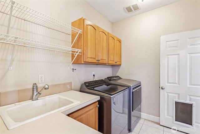 10400 NE 197th St, Battle Ground, WA 98604 - laundry room with cabinet space, independent washer and dryer, and light tile patterned floors
