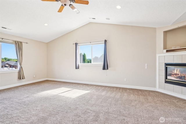 10400 NE 197th St, Battle Ground, WA 98604 - unfurnished living room featuring carpet, a tile fireplace, lofted ceiling, a ceiling fan, and recessed lighting