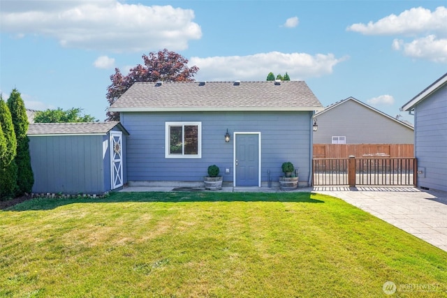 10400 NE 197th St, Battle Ground, WA 98604 - back of house featuring a storage unit and roof with shingles