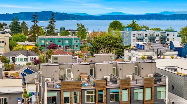 3019 62nd Ave SW Unit D, Seattle, WA 98116 - drone / aerial view of a water and mountain view