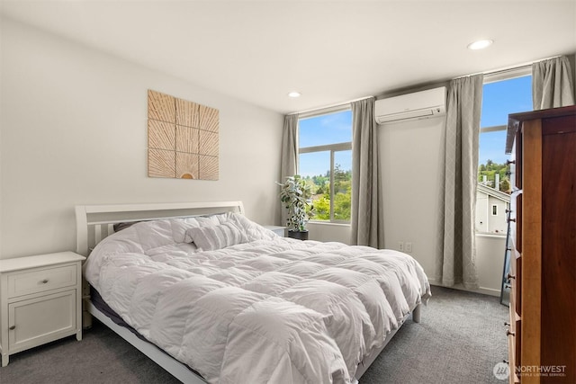 3019 62nd Ave SW Unit D, Seattle, WA 98116 - bedroom featuring an AC wall unit, dark colored carpet, and recessed lighting