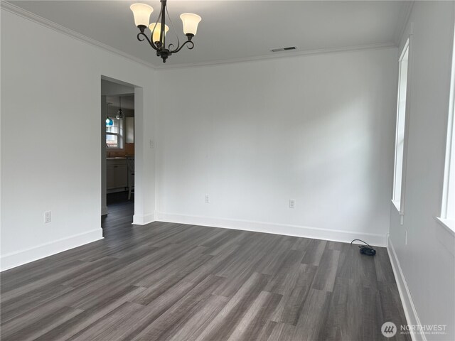 715 Ford Ave, Snohomish, WA 98290 - unfurnished room with a chandelier, dark wood-style floors, and crown molding
