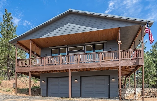 108 Hummingbird Rd, East Wenatchee, WA 98802 - view of front of house with a garage, a wooden deck, and dirt driveway
