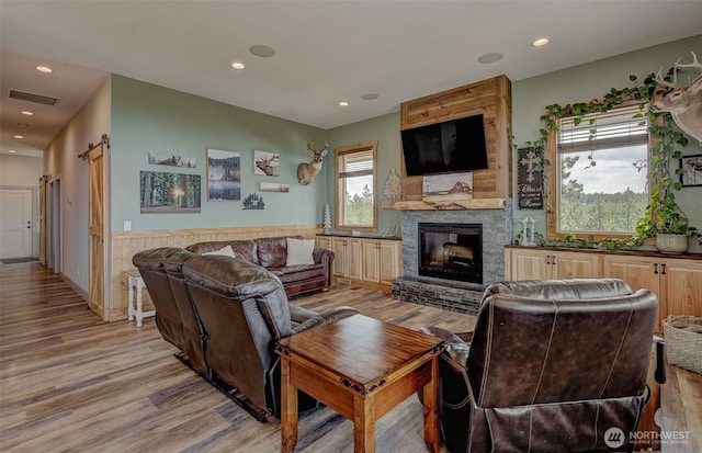 108 Hummingbird Rd, East Wenatchee, WA 98802 - living area with light wood-type flooring, a fireplace, recessed lighting, and wainscoting