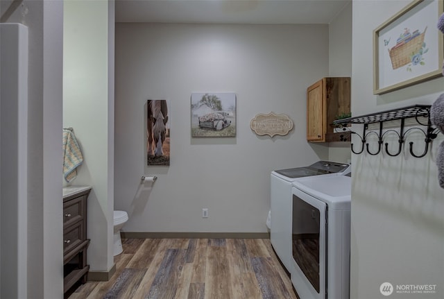 108 Hummingbird Rd, East Wenatchee, WA 98802 - washroom featuring washing machine and dryer and wood finished floors