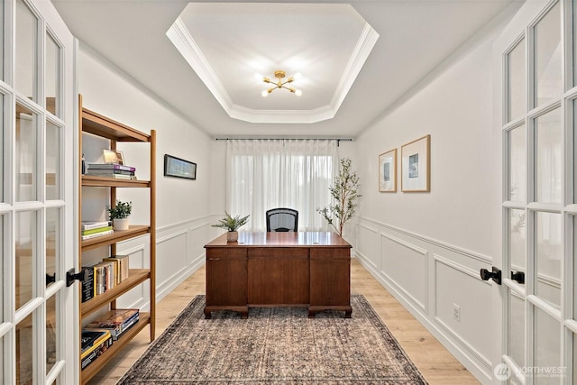 9019 166th St E, Puyallup, WA 98375 - home office featuring light wood-type flooring, a decorative wall, crown molding, a raised ceiling, and a wainscoted wall