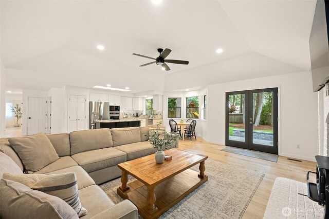 9019 166th St E, Puyallup, WA 98375 - living area featuring plenty of natural light, recessed lighting, french doors, light wood-style floors, and lofted ceiling