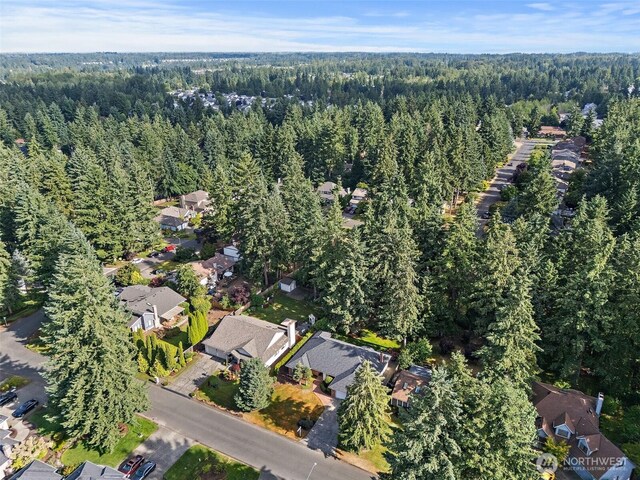 9019 166th St E, Puyallup, WA 98375 - aerial overview of property's location with a heavily wooded area and nearby suburban area