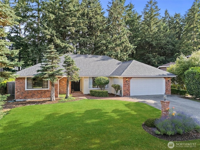 9019 166th St E, Puyallup, WA 98375 - single story home with driveway, a front yard, a garage, a shingled roof, and brick siding