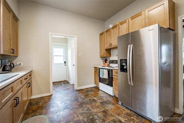 1639 King St, Bellingham, WA 98225 - kitchen featuring stainless steel refrigerator with ice dispenser, white range with electric stovetop, stone finish flooring, light countertops, and light brown cabinets