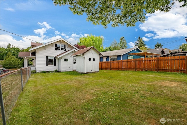 1639 King St, Bellingham, WA 98225 - back of house featuring a fenced backyard and a storage unit