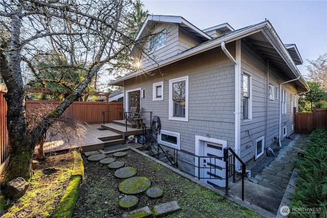 6306 17th Ave NE, Seattle, WA 98115 - view of side of property with a fenced backyard and a wooden deck