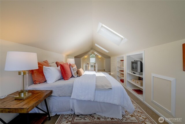 6306 17th Ave NE, Seattle, WA 98115 - bedroom featuring a skylight, vaulted ceiling, and carpet flooring
