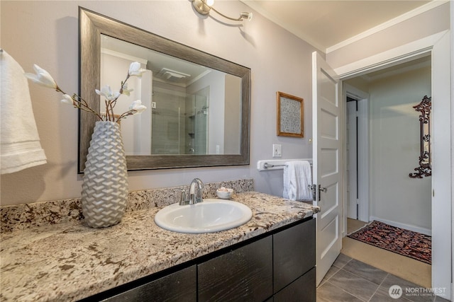 6306 17th Ave NE, Seattle, WA 98115 - full bath featuring ornamental molding, vanity, a stall shower, and tile patterned floors