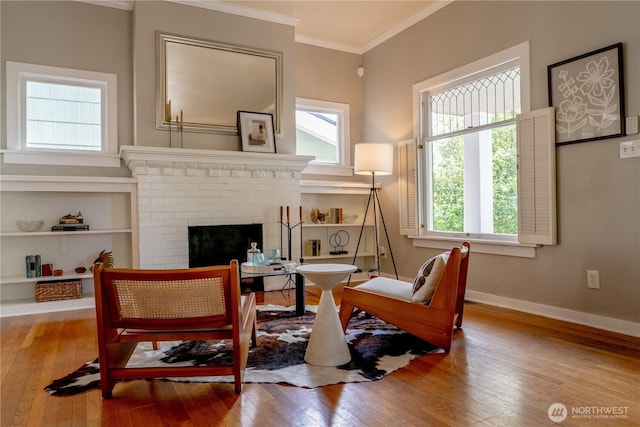 6306 17th Ave NE, Seattle, WA 98115 - living area with crown molding, wood-type flooring, healthy amount of natural light, and a fireplace