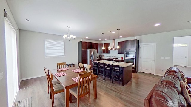 4218 SW Colbert Way, Port Orchard, WA 98367 - dining space with a chandelier, light wood finished floors, and recessed lighting