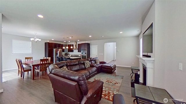 4218 SW Colbert Way, Port Orchard, WA 98367 - living area with a chandelier, wood finished floors, a fireplace, and recessed lighting