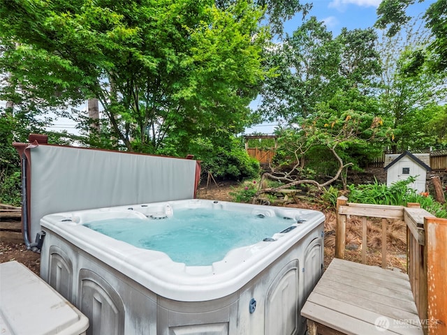 9420 S Sheridan Ave, Tacoma, WA 98444 - wooden deck with a hot tub and a storage unit